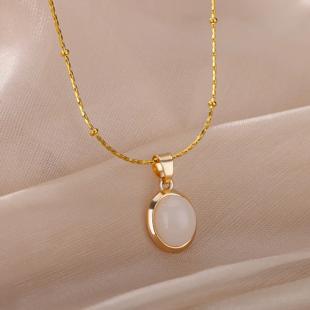 Opulent Opal Oval Necklace: Women's stainless steel, gold-colored pendant. Perfect for weddings, a chic jewelry gift with aesthetic allure. Yoga Shop 2018